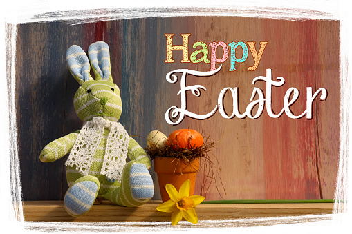 Happy easter text with bunny on painted background with white frame and copy space