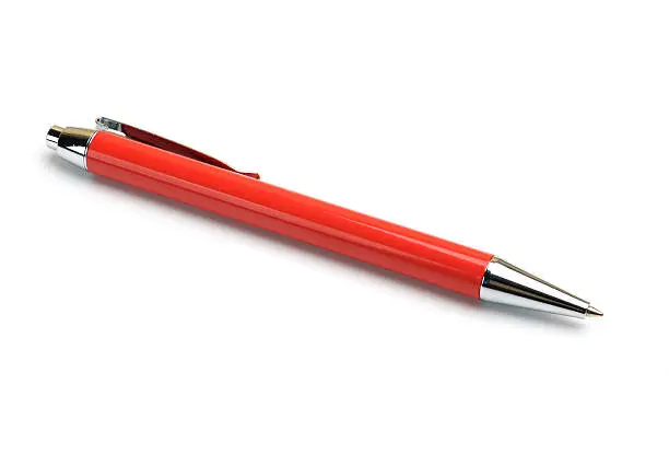 Red metal ballpoint pen on a white background.