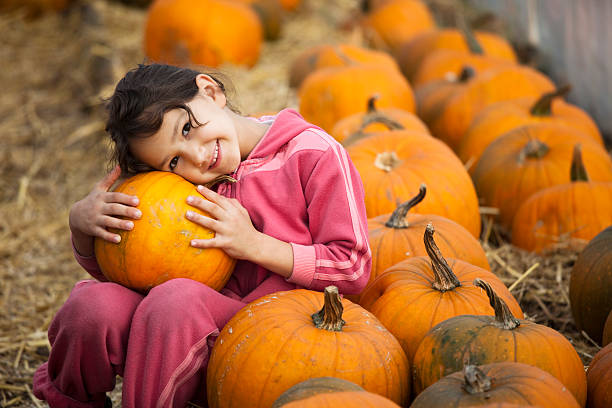 istock Girl with pumpkin. 482968991