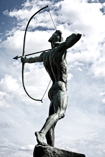 An archer statue in Dresden, Germany against sky.