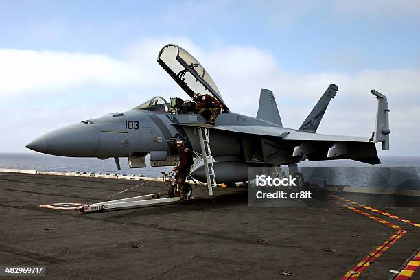 Servicing An Fa18 Superhornet Stock Photo - Download Image Now - FA-18 Hornet, Fighter Plane, Aircraft Carrier