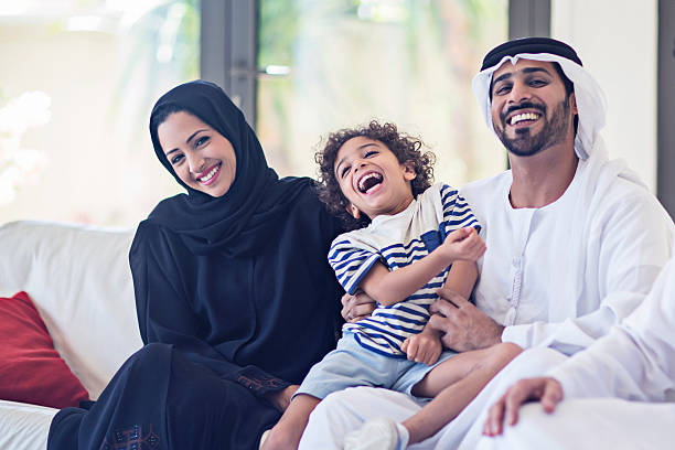 Emirati family portrait Portrait of a middle eastern family looking at the camera. middle eastern culture stock pictures, royalty-free photos & images