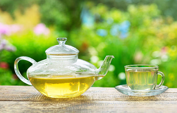 istock cup of green tea and teapot 482971418