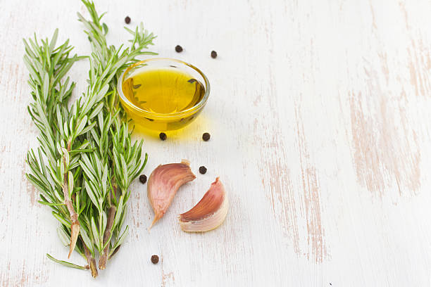 istock rosemary with oil and garlic, close up 482971692