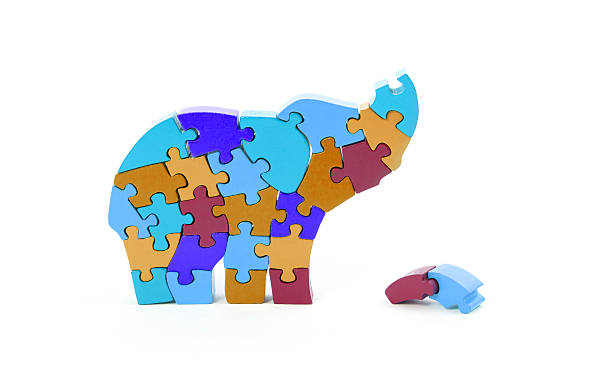 istock Colorful puzzle pieces in elephant shape 482972252