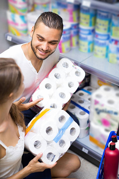 istock Couple selecting toilet paper in store 482974352