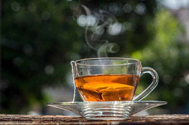 istock Cups of tea with bokeh on wooden table 482975698