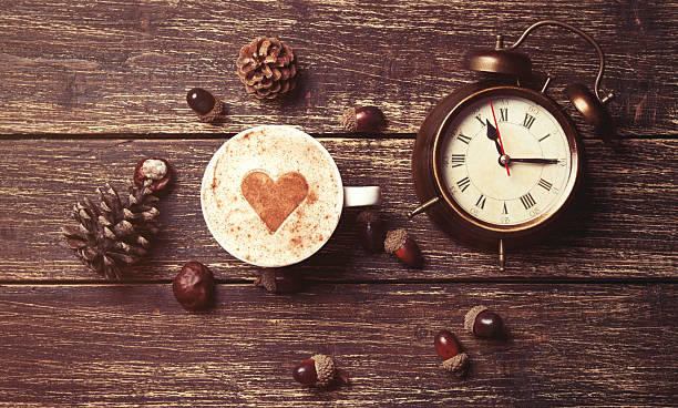 istock Cup of coffee and alarm clock 482978876