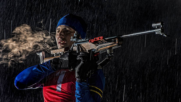 istock Biathlon competitor preparing for target shooting at night 482983386