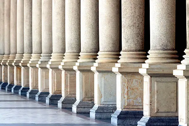 Row of classical columns, full frame horizontal composition, copy space