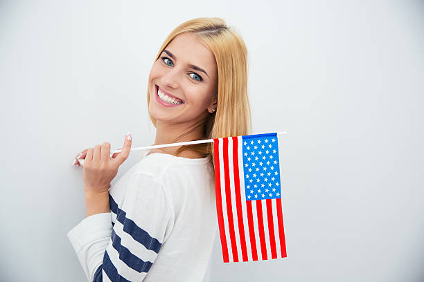 istock Girl holding USA flag 482986498