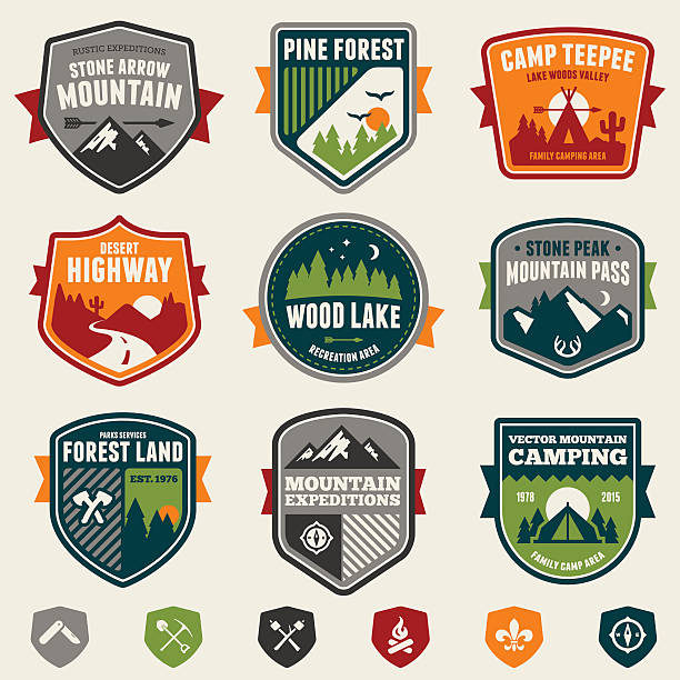 Woods badges and icons Set of vintage woods camp badges and travel emblems. textile patch stock illustrations