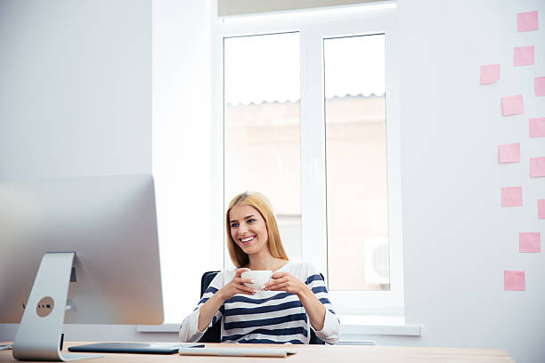istock Female photo editor drinking coffee 482986880