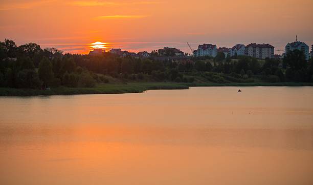istock Summertime landscape with sunset over lake 482987076