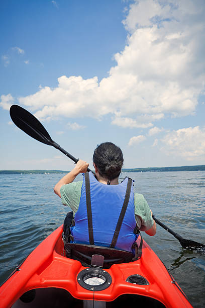 istock Man Rowing Kayak On A Large Lake 482987112