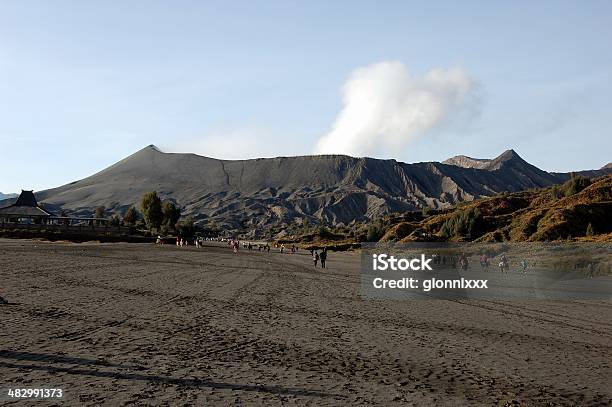 Mount Bromo And Sea Of Black Sand East Java Stock Photo - Download Image Now - Active Volcano, Ancient, Bromo-Tengger-Semeru National Park