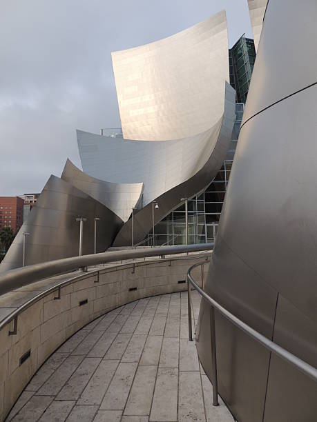 Walt Disney Concert Hall Los Angeles, USA - March 23, 2014. Walt Disney Concert Hall in the early morning sunrise March 23, 2014. The hall was designed by architect Frank Gehry and is the fourth hall of the Los Angeles Music Center. It is the home of the Los Angeles Philharmonic Orchestra and the Los Angeles Master Chorale. frank gehry building stock pictures, royalty-free photos & images