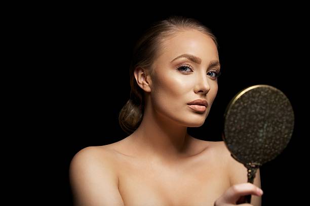 istock Attractive young female model with a mirror 482992659