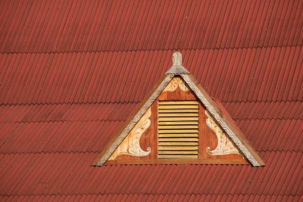 Dormer window in red corrugated iron roof