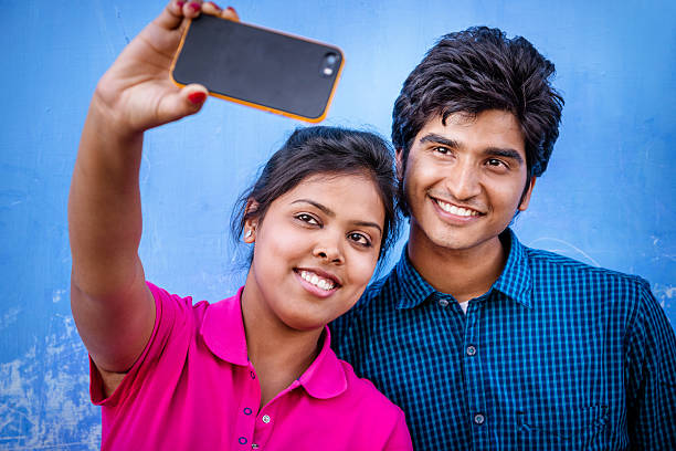 taking a selfie in India friends or couple taking a selfie india indigenous culture indian culture women stock pictures, royalty-free photos & images