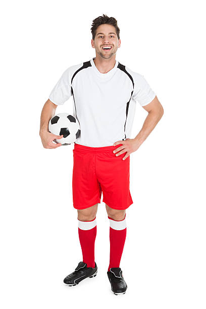 soccer player holding football - ユニフォームサッカー 個照片及圖片檔
