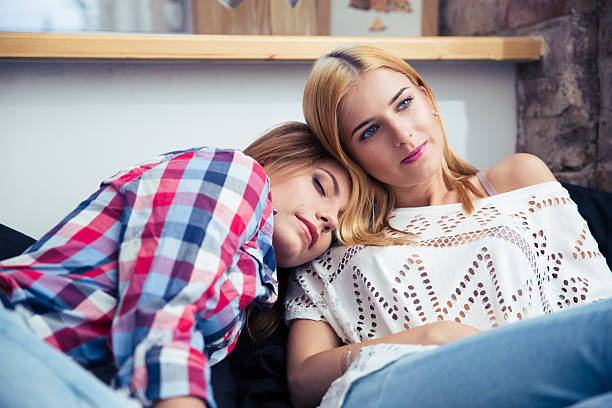 istock Two women resting on the sofe 483004588