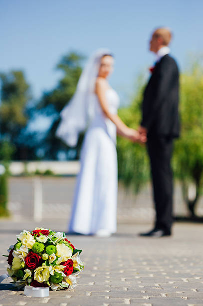 istock Bride and Groom at wedding Day walking Outdoors, embracing in 483004604