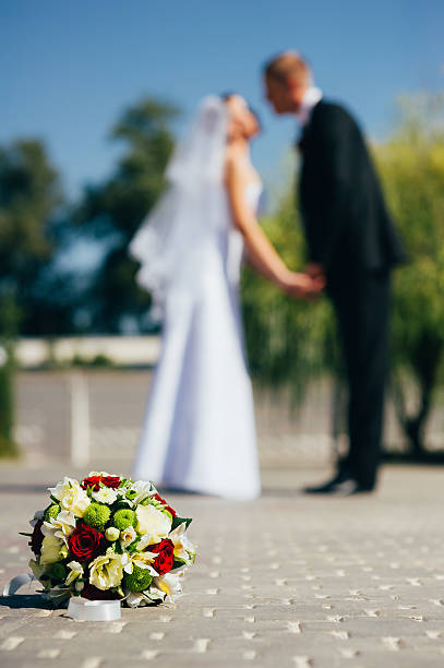 istock Bride and Groom at wedding Day walking Outdoors, embracing in 483004606