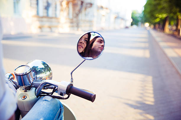 istock Couple reflected in the scooter mirror 483005152
