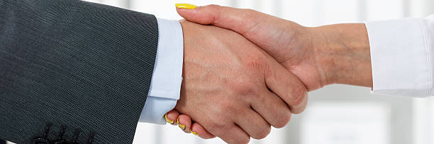 istock Male and female handshake in office 483005412