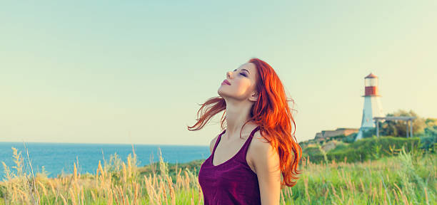 istock girl near Lighthouse 483014198