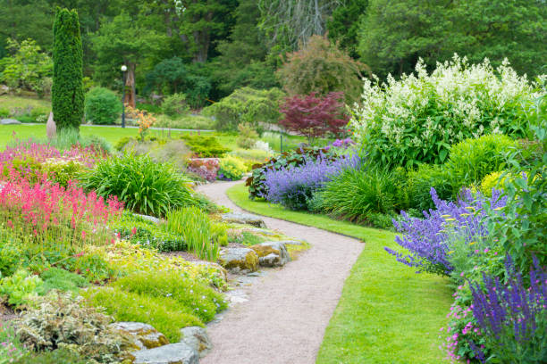 istock Green park flowerbeds 483018188