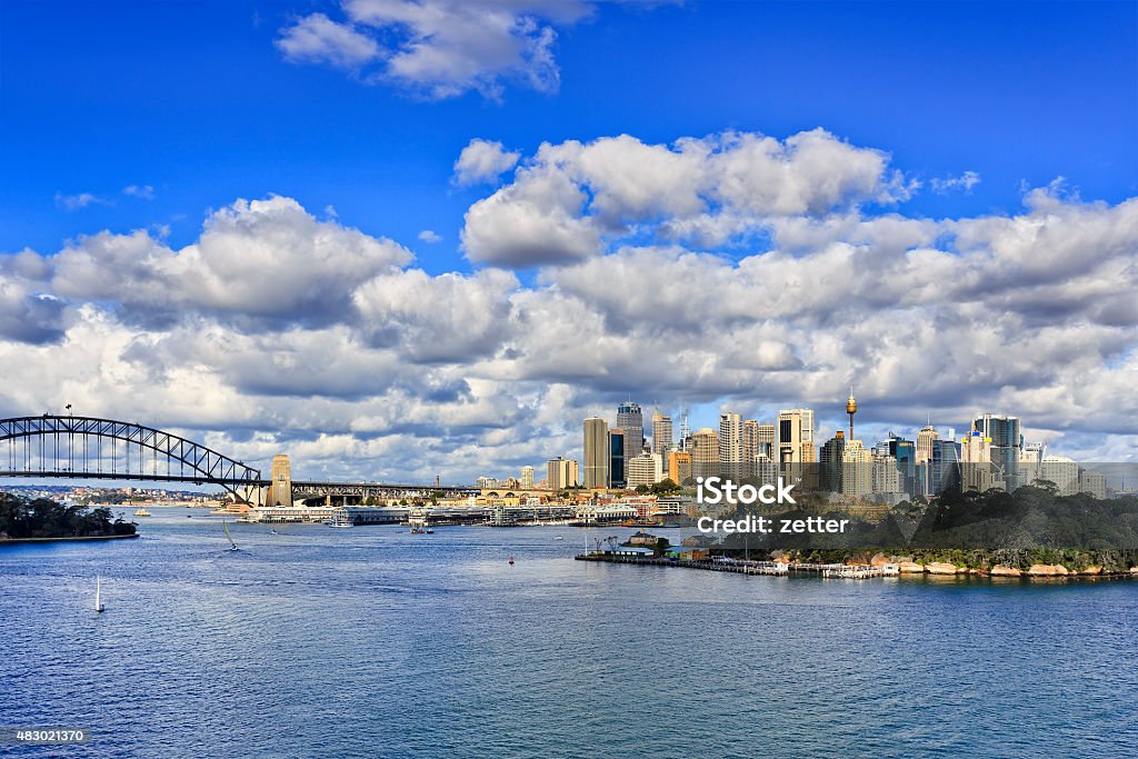 Sydney CBD Balls head day Australian capital city Sydney landmarks from Balls Head reserve on bright sunny day across blue still waters of Harbour with bridge and CBD skyscrapers over horizon 2015 Stock Photo