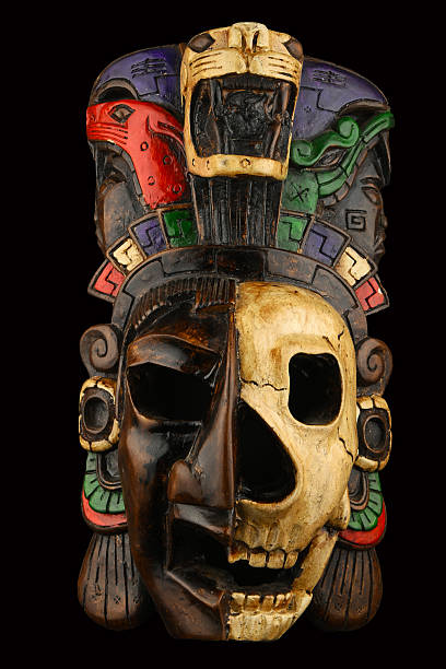 istock Mexican Mayan Aztec ceramic painted mask skull isolated on black 483036904