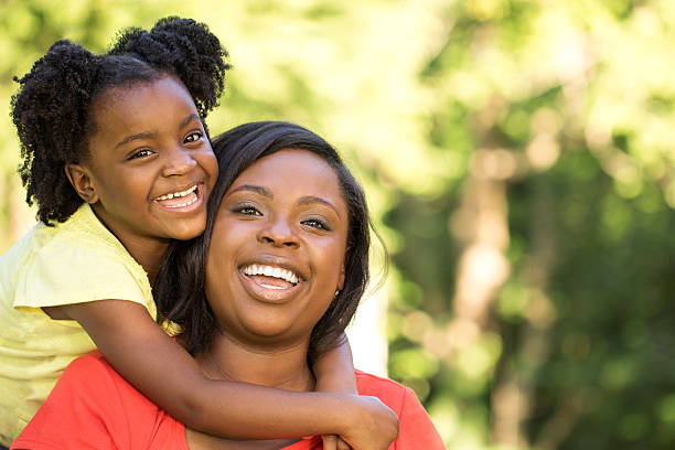 istock Mother laughing and hugging her daughter 483041238