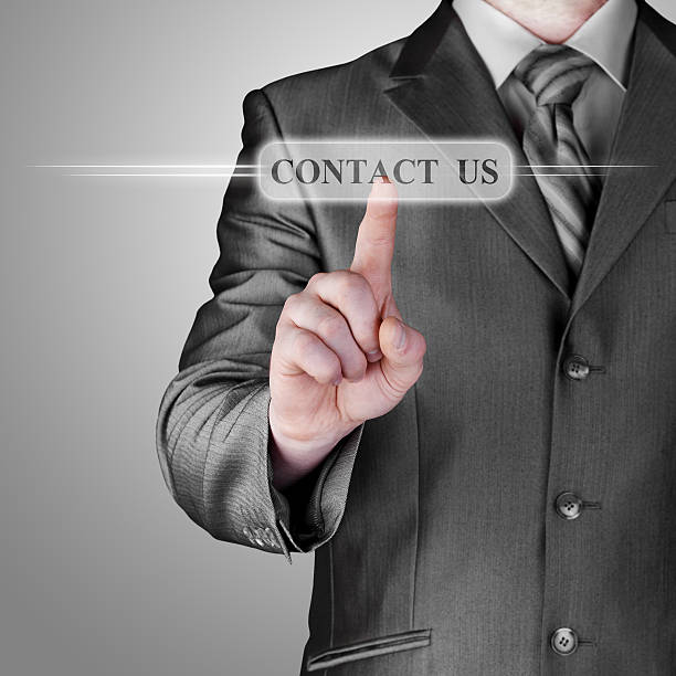 istock Businessman pushing CONTACT US sign 483046511