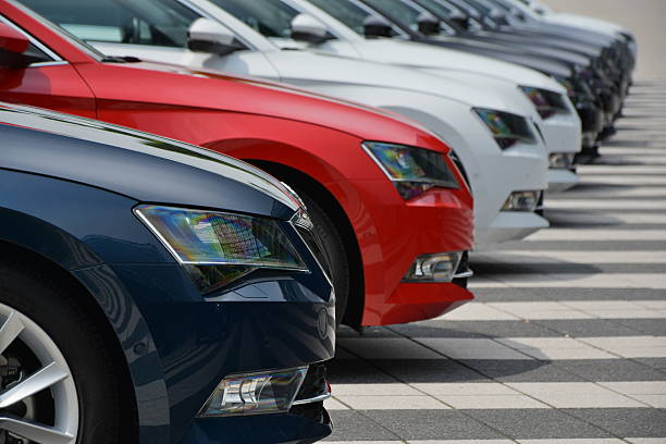 Row of used car with prices.
