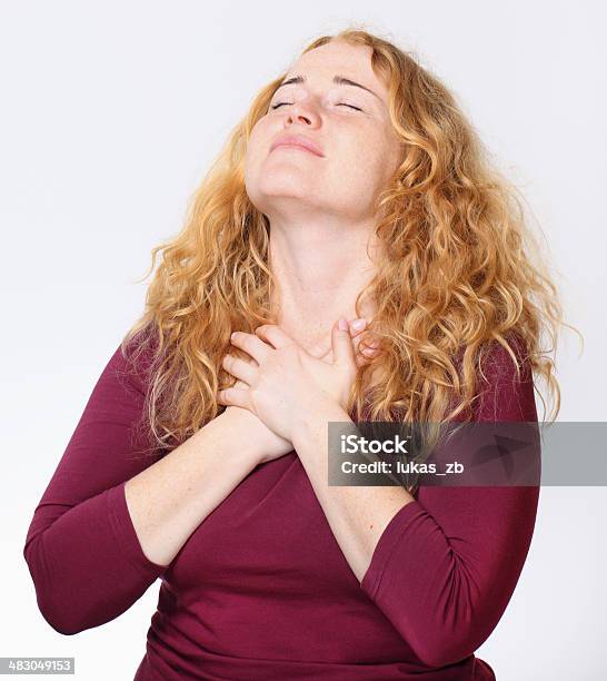 Happy Exhilarated Young Woman Portrait Stock Photo - Download Image Now - Hand On Heart, Hands On Chest, Women