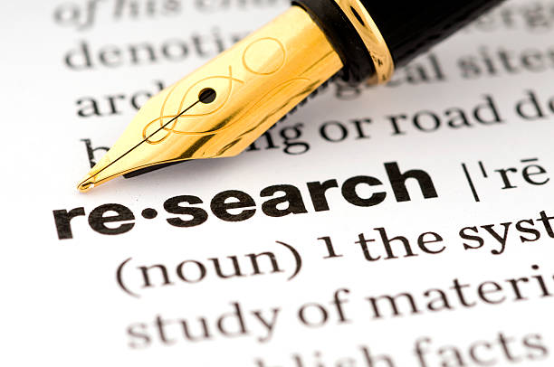 istock Research in a dictionary with a fountain pen 483051521