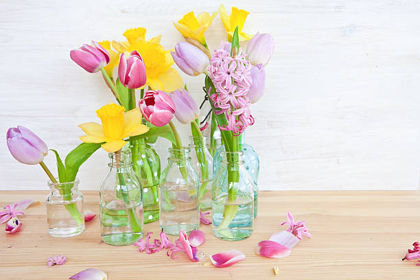 istock Colorful flowers in little bottles 483051601