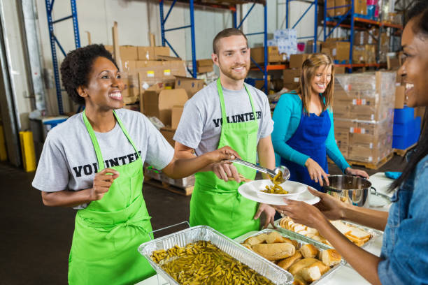 istock Diverse volunteers serving hot meal at soup kitchen 483051741