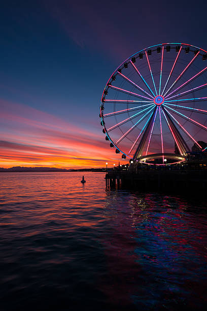 Vivid Sunset of Elliott Bay A vivid sunset on Elliott bay. seattle ferris wheel stock pictures, royalty-free photos & images