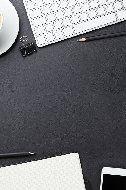 istock Office leather desk with computer, supplies and coffee 483055226