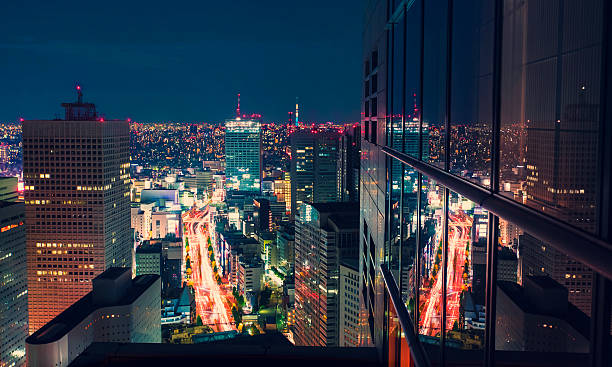 Aerial view cityscape at night in Tokyo, Japan Aerial view of a massive highway intersection at night in Shinjuku, Tokyo, Japan from a skyscraper shinjuku ward photos stock pictures, royalty-free photos & images
