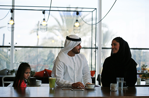 Arabian family enjoying leisure time in a cafe