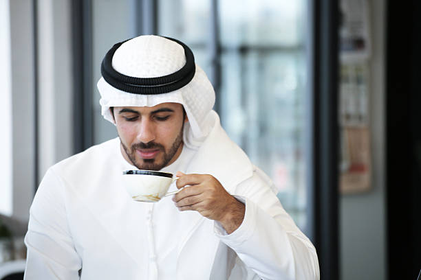 Arab man drinking coffee stock photo