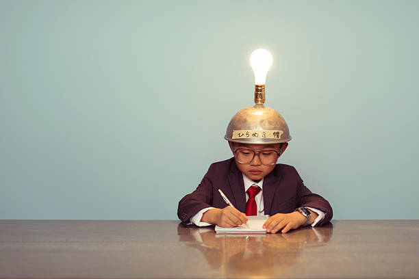 istock Young Japanese Business Boy Wearing Lit Up Thinking Cap 483057494