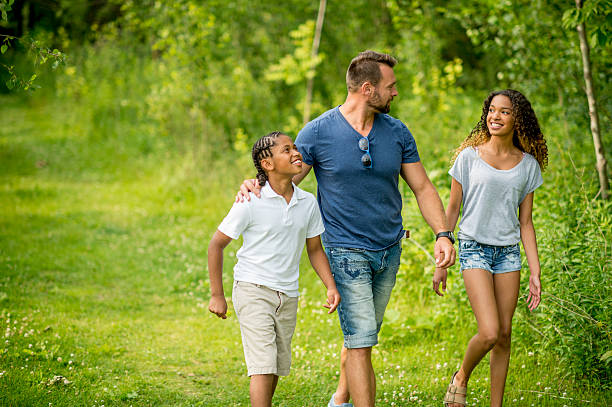 istock Father and Children Walking Through Park 483060810