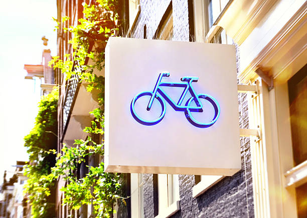 Bicycle store Bicycle sign of a bicycle shop. Building exterior of a bicycle shop in the sunlight. bicycle shop stock pictures, royalty-free photos & images
