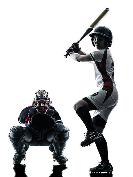 istock women playing softball players silhouette isolated 483062376